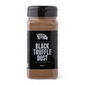 A clear plastic spice jar of Truffle Pig Black Truffle Dust with a black lid and black label, set against a plain white background.