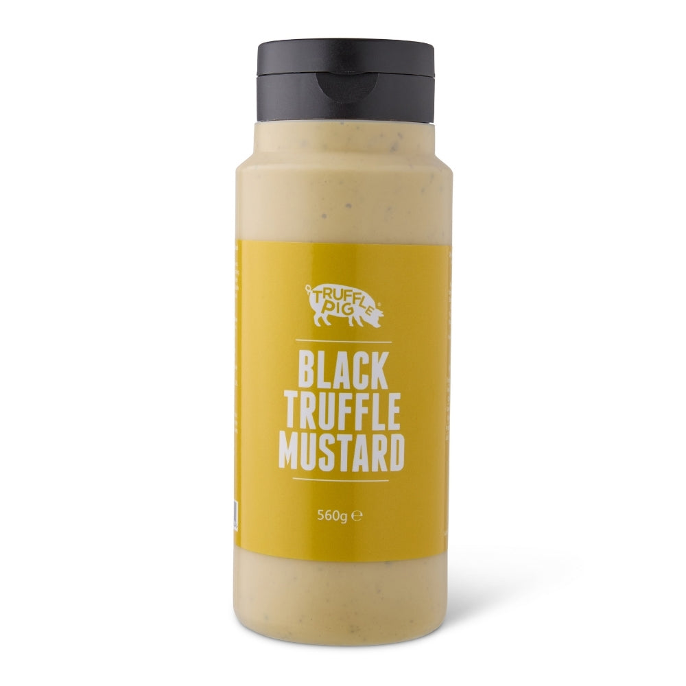 A bottle of Truffle Pig Black Truffle Mustard on a clean white background. The clear bottle shows the textured beige mustard sauce inside, with a prominent mustard-yellow label and a black cap.