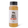 A bottle of Truffle Pig White Truffle Hot Honey, honey inside a clear plastic bottle with a black cap and a white label.