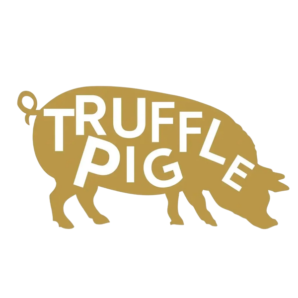A stylized gold pig silhouette with the words 'TRUFFLE PIG' in large white letters across the center, shown on a plain white background.